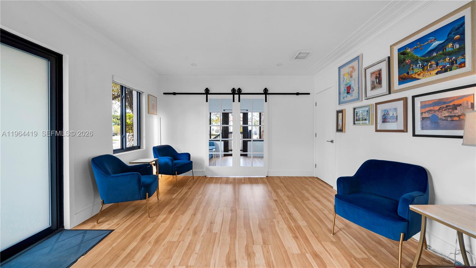 375 Southwest 32nd Road Miami, FL 33129 - Photo 6 of 39 a living room with furniture and wooden floor