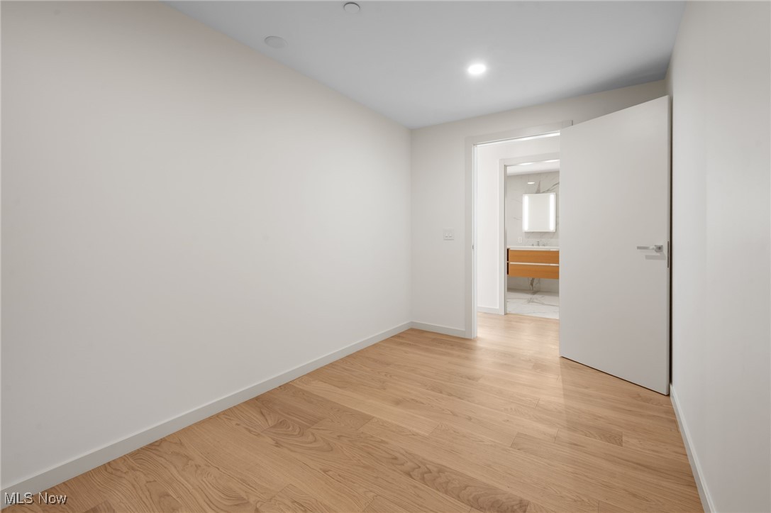 22700 Lake Road, Unit 306 Rocky River, OH 44116 - Photo 19 of 28 Unfurnished room featuring light wood finished floors and recessed lighting