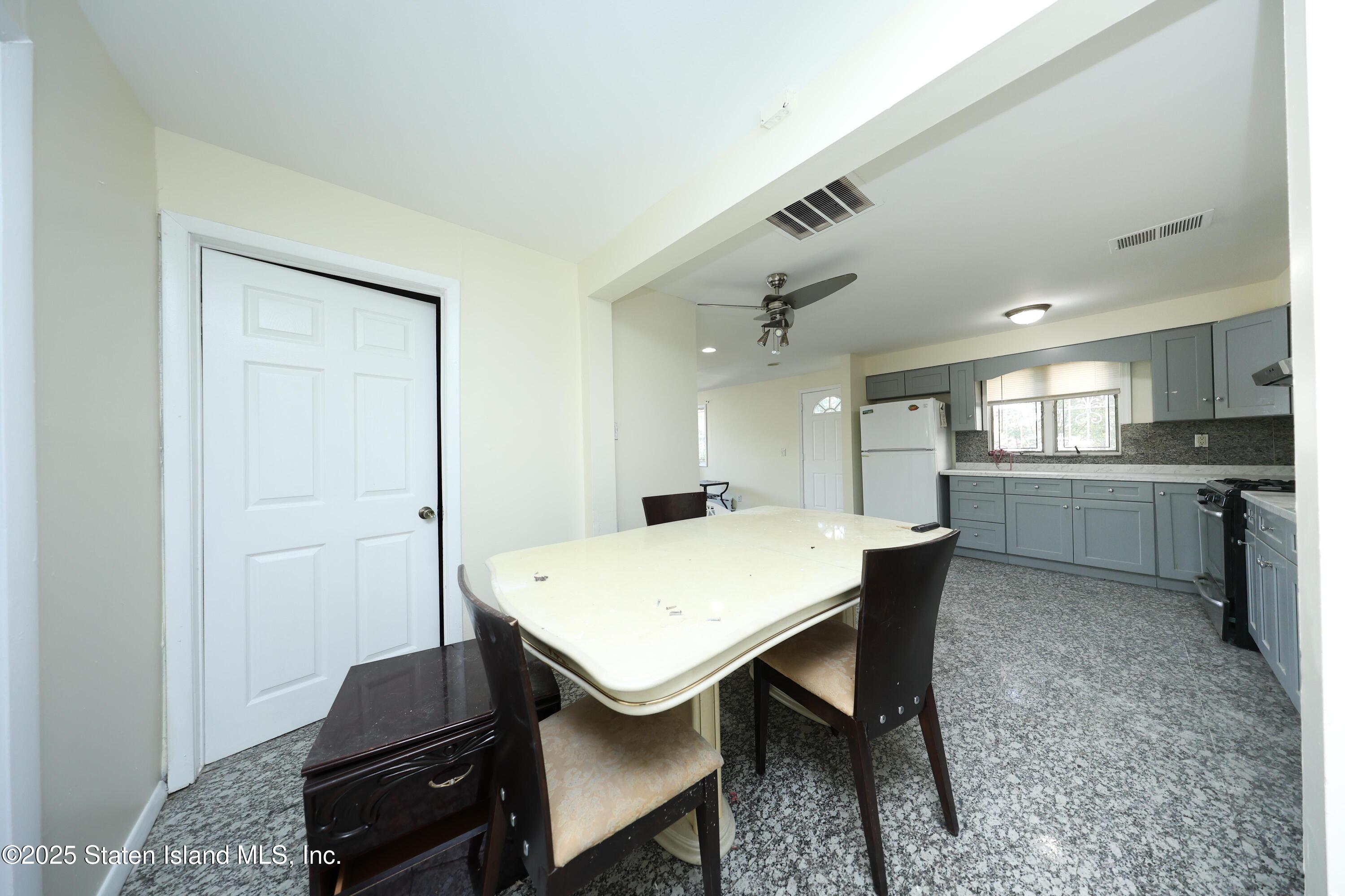 4664 Amboy Road Staten Island, NY 10312 - Photo 14 of 33 a view of a dining room with furniture