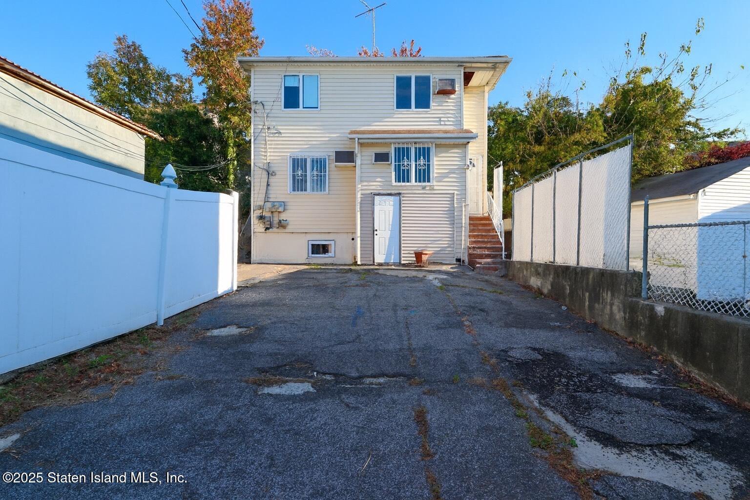 4664 Amboy Road Staten Island, NY 10312 - Photo 2 of 33 a view of a house with a yard