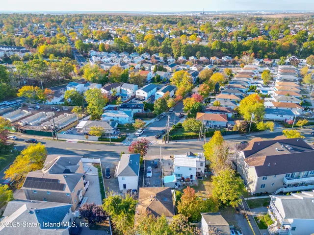 an aerial view of residential houses with outdoor space