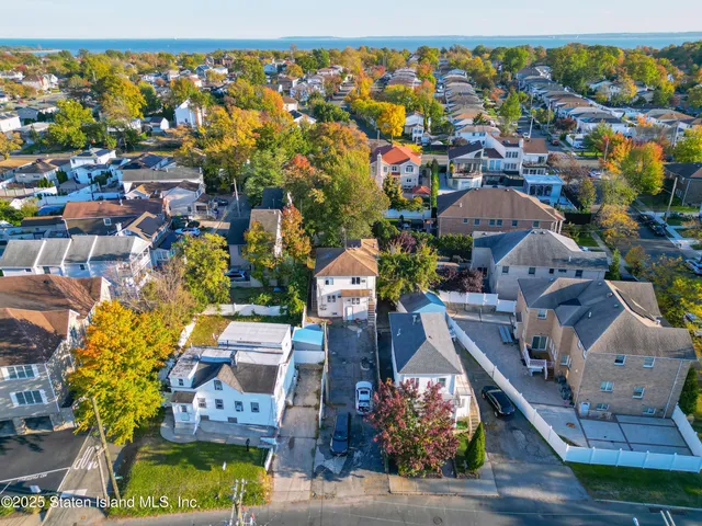 an aerial view of residential houses with outdoor space