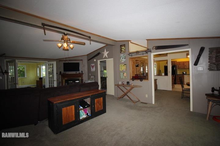 1629 North Farwell Bridge Road Ridott, IL 61067 - Photo 11 of 25 a living room with furniture and a flat screen tv