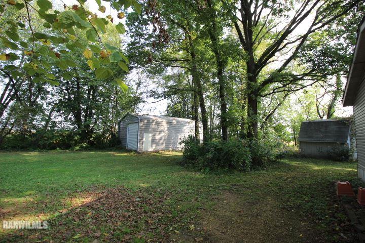 1629 North Farwell Bridge Road Ridott, IL 61067 - Photo 8 of 25 a view of a backyard