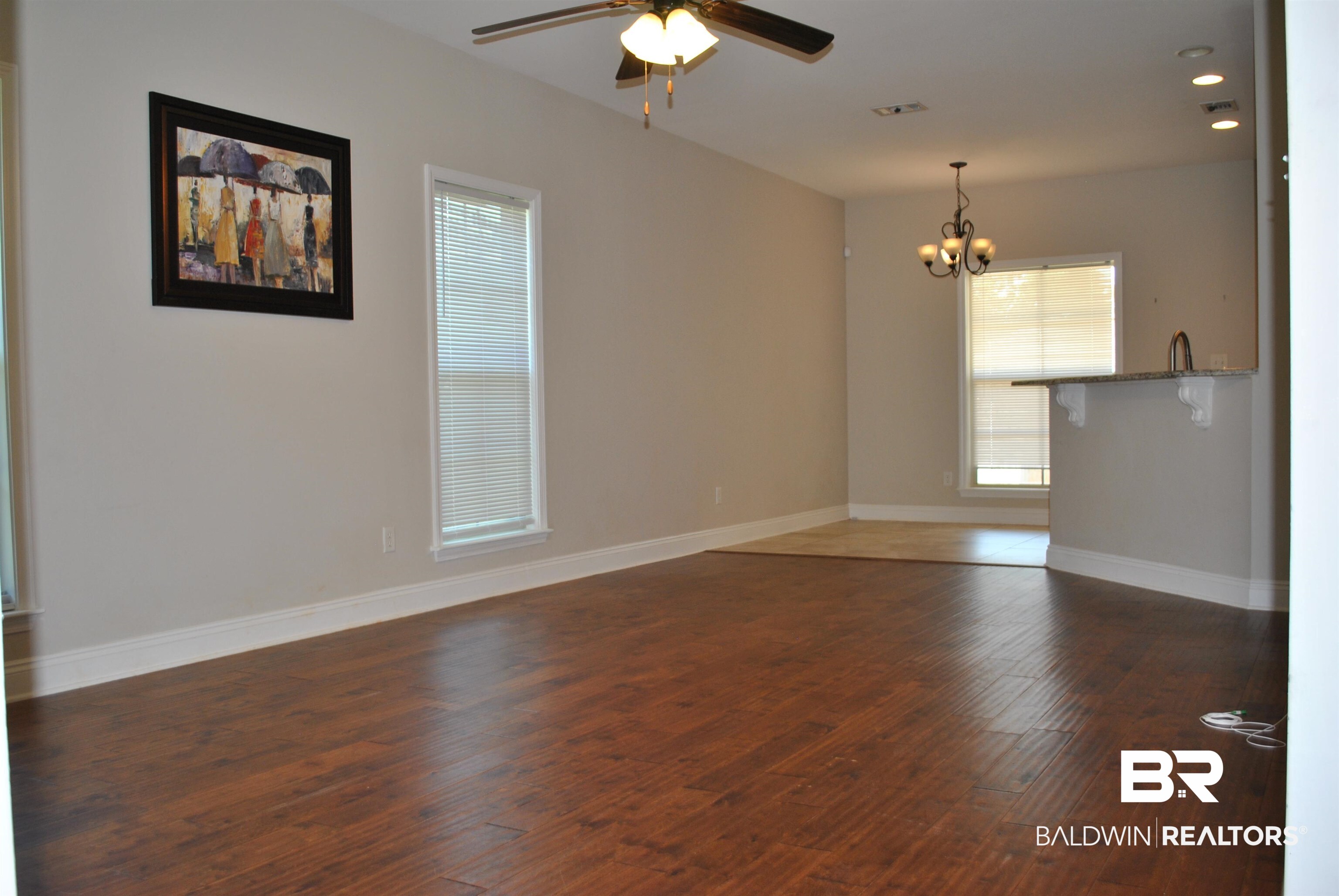 2161 Spring Grove West Mobile, AL 36695 - Photo 7 of 31 Empty room featuring a chandelier, a ceiling fan, wood finished floors, and recessed lighting
