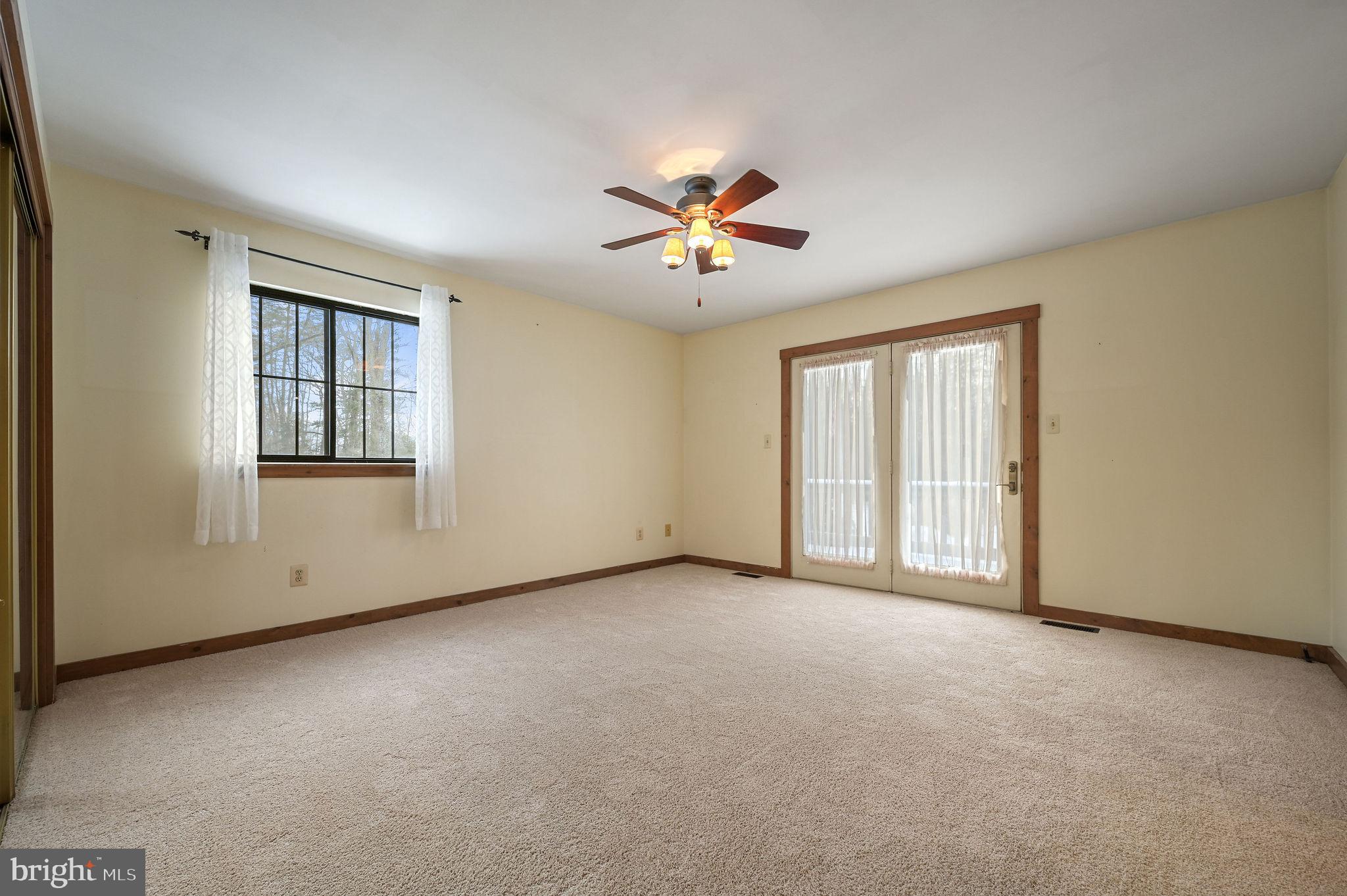 12820 Porters Landing Road Greensboro, MD 21639 - Photo 33 of 72 Primary bedroom with French doors to private deck