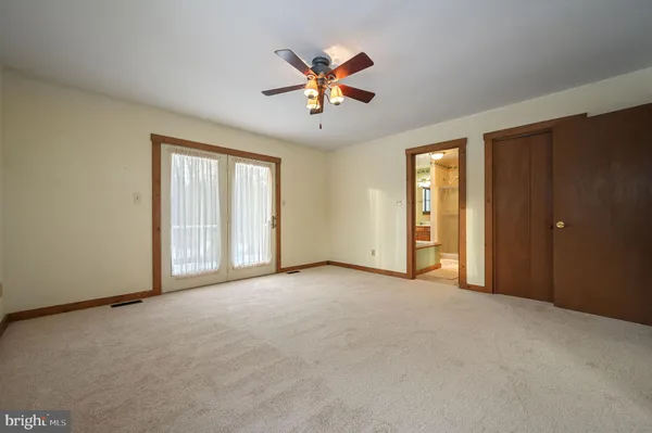 a view of a backyard with swimming pool