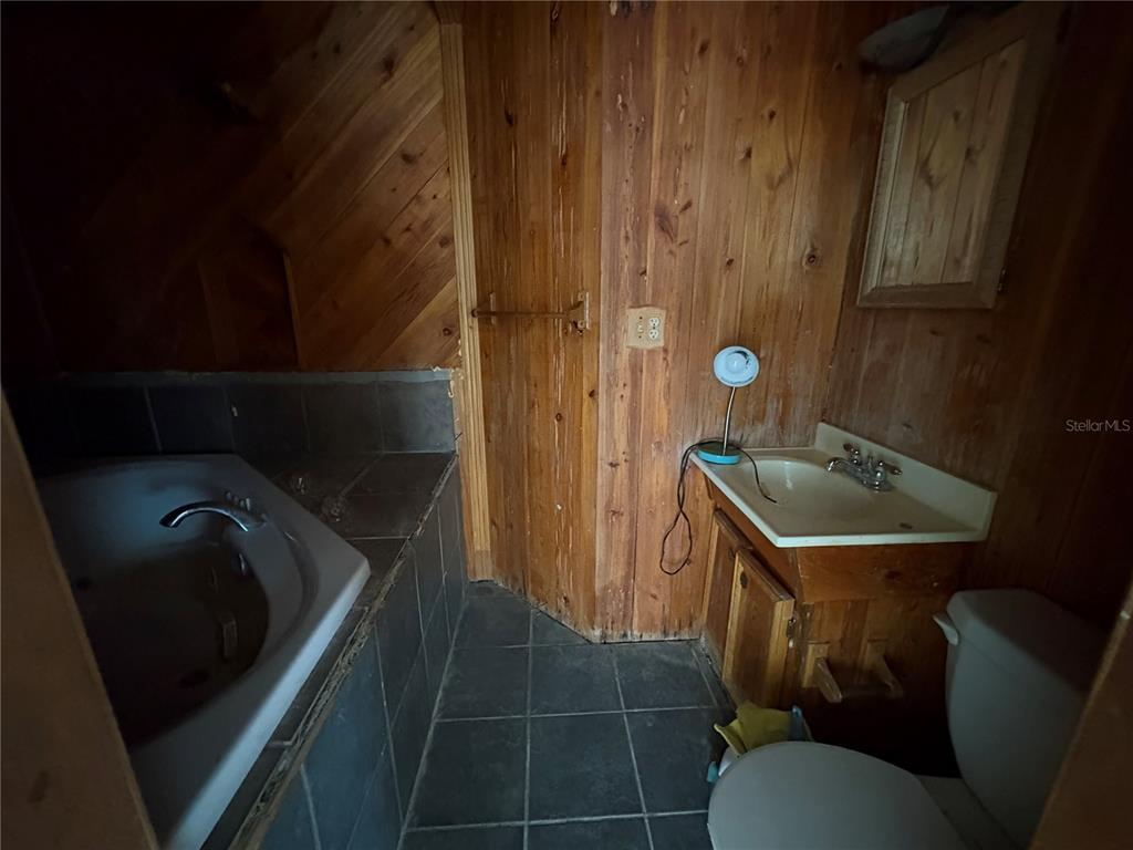 3922 South Apopka Avenue Inverness, FL 34452 - Photo 19 of 39 a bathroom with a sink and toilet