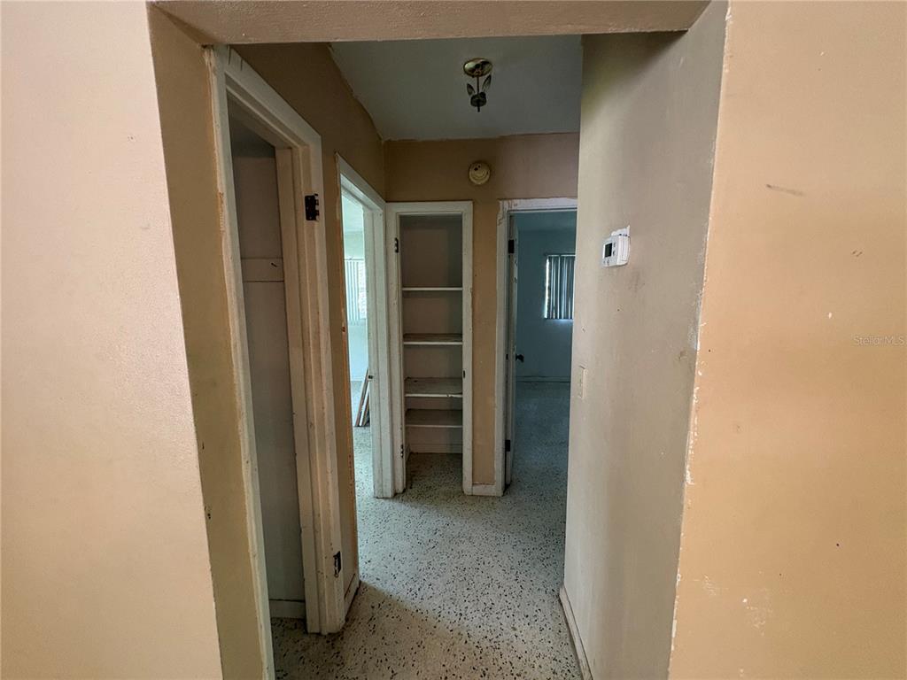 3922 South Apopka Avenue Inverness, FL 34452 - Photo 22 of 39 a view of a hallway with wooden shelves