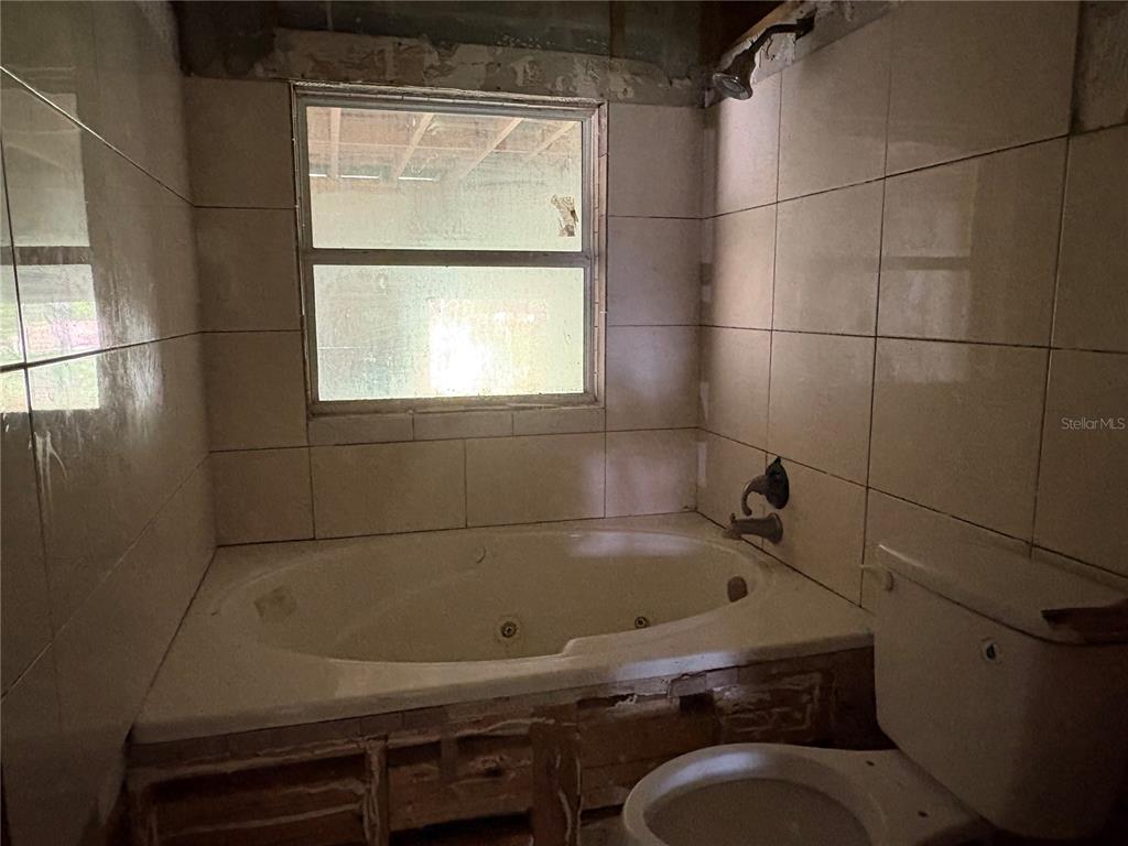 3922 South Apopka Avenue Inverness, FL 34452 - Photo 25 of 39 a bathroom with a sink toilet and shower