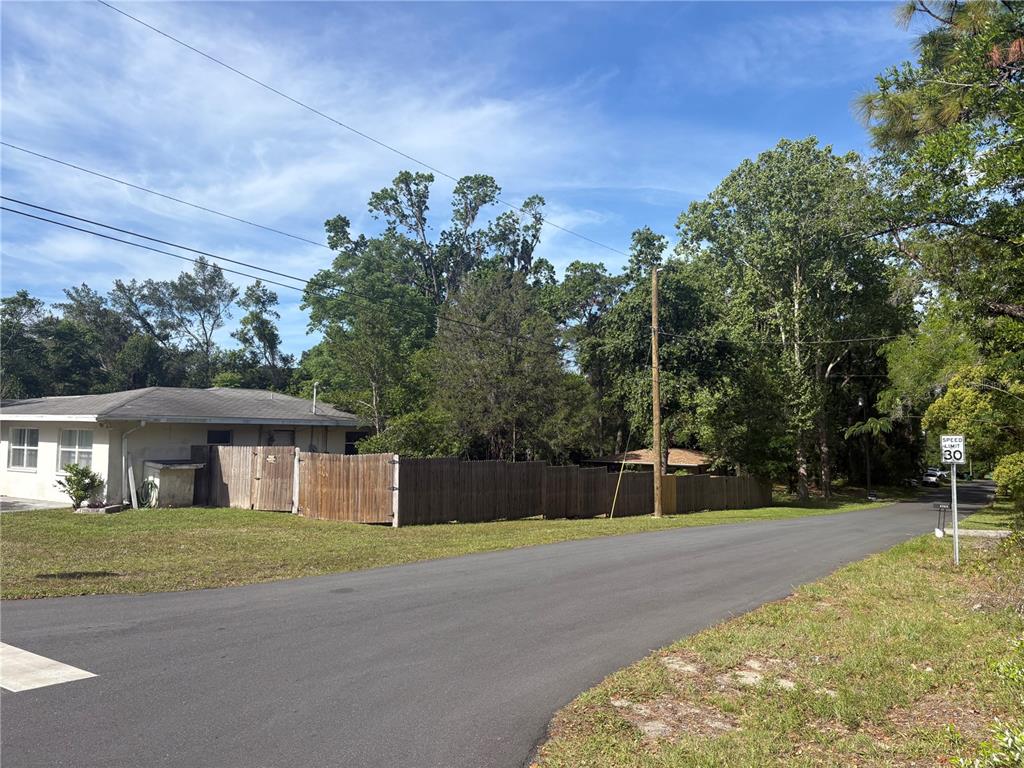 3922 South Apopka Avenue Inverness, FL 34452 - Photo 33 of 39 a front view of a house with a yard
