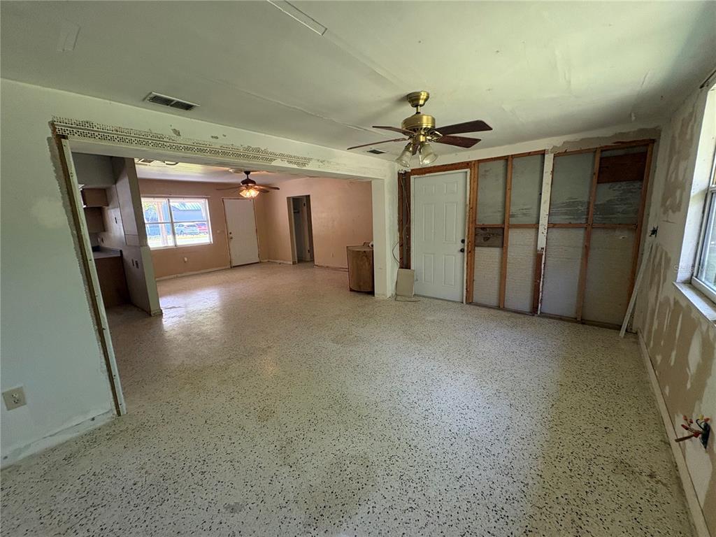3922 South Apopka Avenue Inverness, FL 34452 - Photo 9 of 39 a view of a hallway with a garage