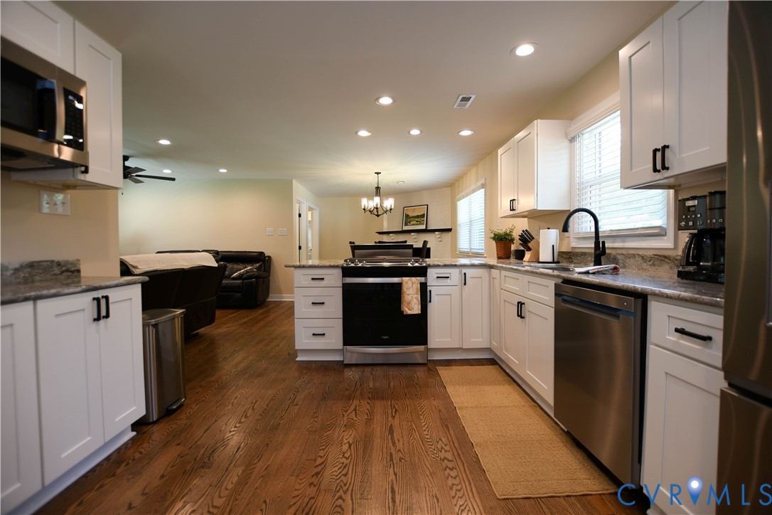 1448 Canterbury Road St. Stephens Church, VA 23148 - Photo 19 of 57 Modern kitchen featuring white shaker cabinetry wi