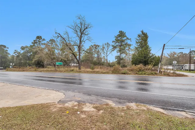 a view of a road with a building in the background