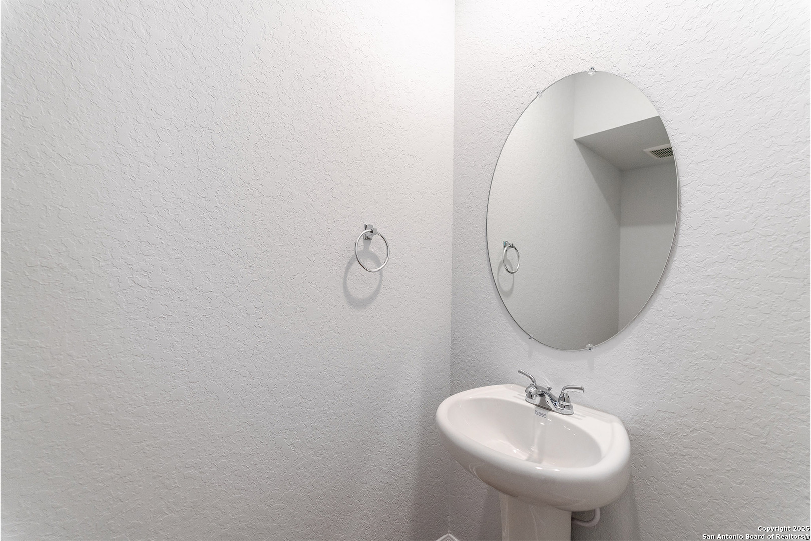 6632 Cibolo Springs Converse, TX 78109 - Photo 15 of 16 a bathroom with a sink and mirror
