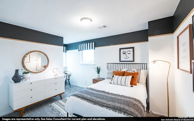 a bedroom with a bed and a dresser