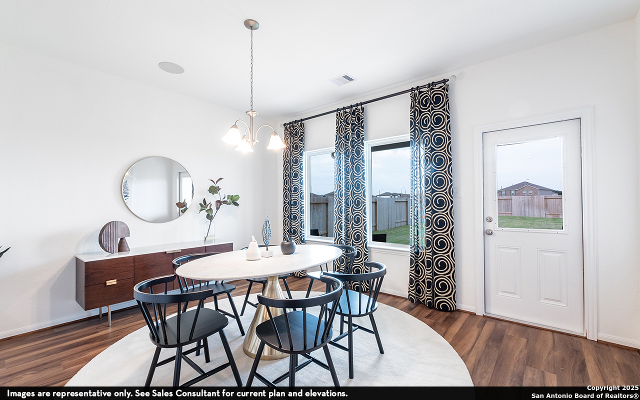 6632 Cibolo Springs Converse, TX 78109 - Photo 8 of 16 a view of a dining room with furniture window and wooden floor