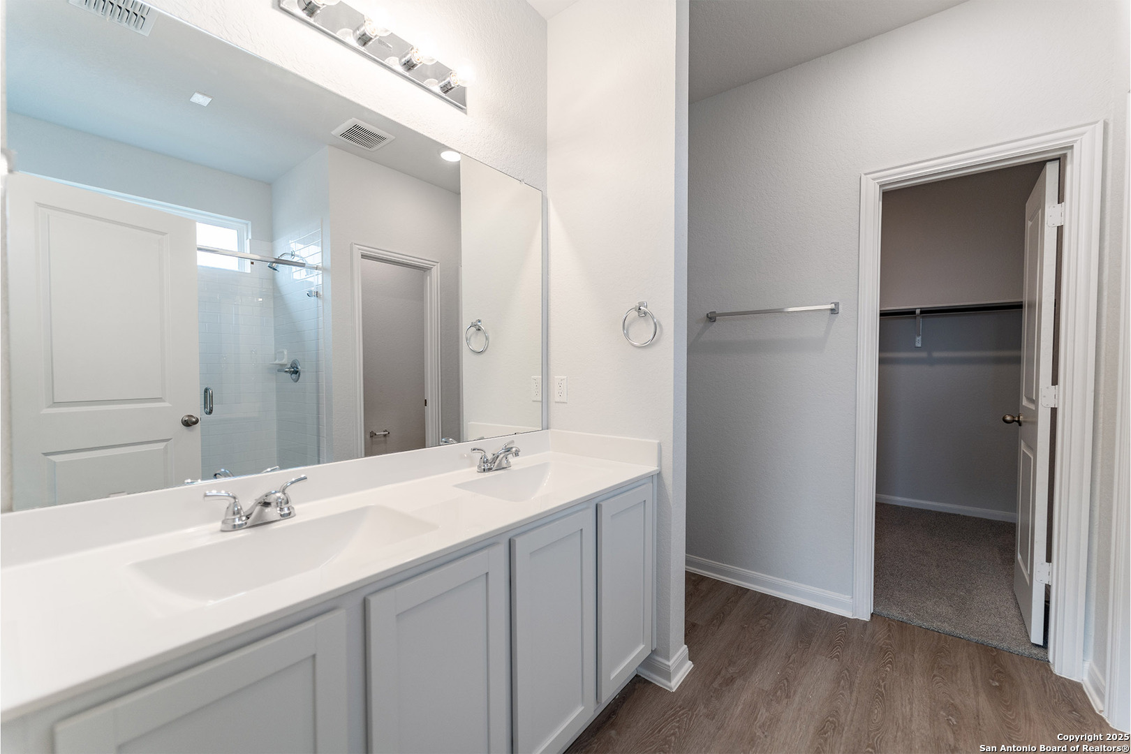 6632 Cibolo Springs Converse, TX 78109 - Photo 10 of 16 a bathroom with a double vanity sink and mirror