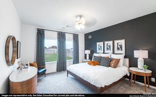 a bedroom with a large bed and a large window