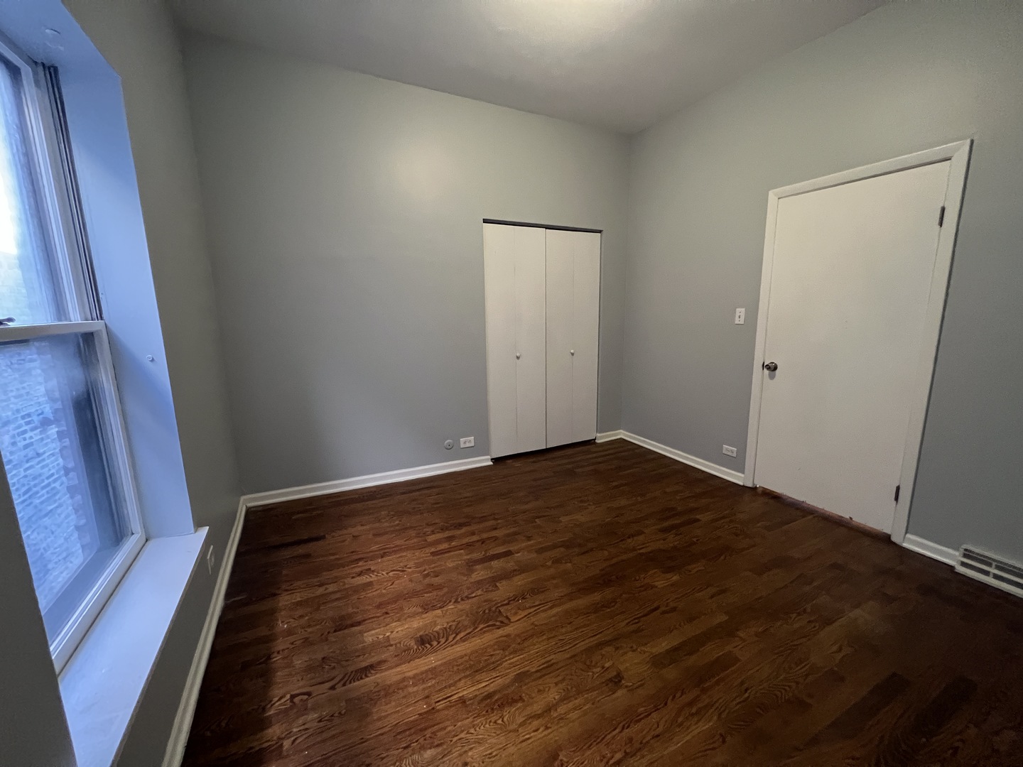 1024 West Byron Street, Unit 3W Chicago, IL 60613 - Photo 15 of 27 a view of an empty room and wooden floor