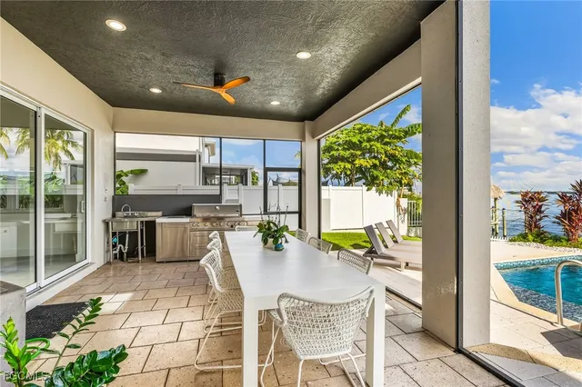 a kitchen with a table and chairs
