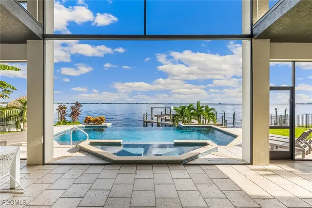 a view of swimming pool with seating area