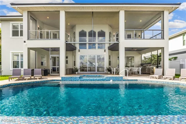 a view of pool with outdoor seating