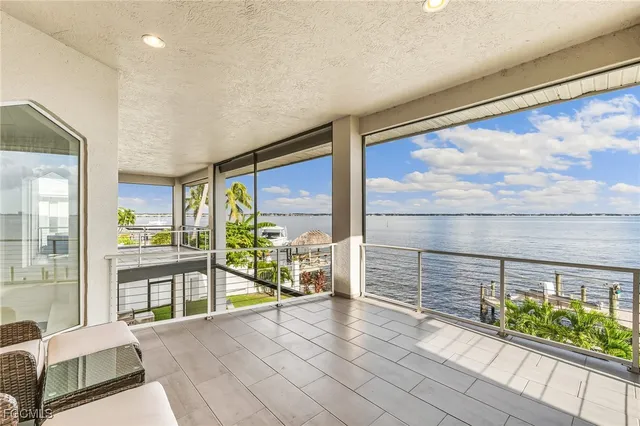 a view of a balcony with chairs