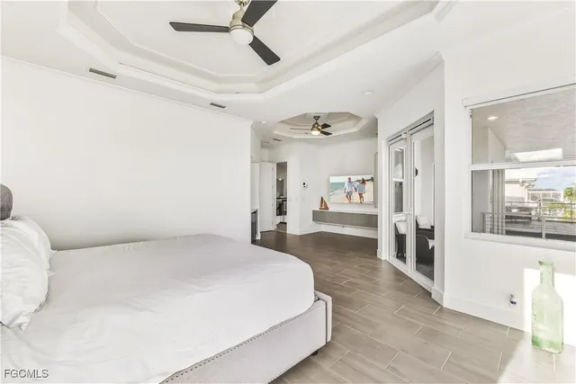 a spacious bedroom with a bed and a window