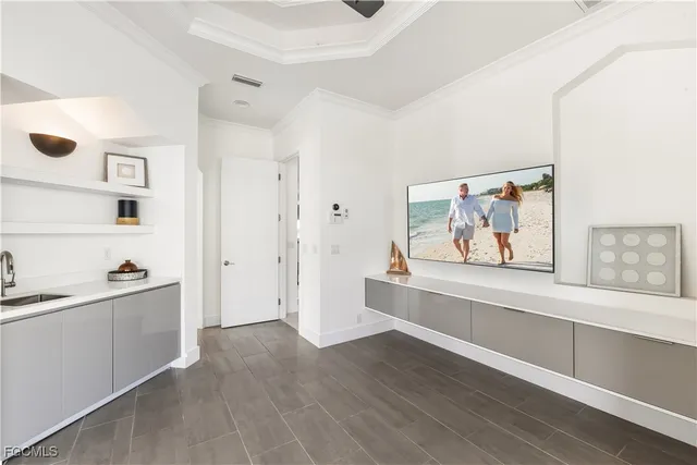 a view of a room with wooden floor and cabinet
