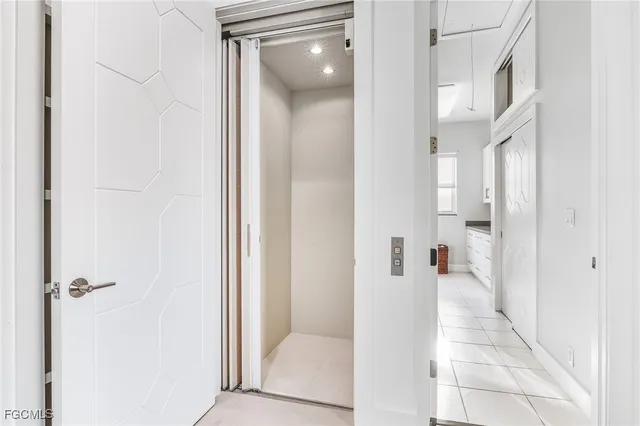 a view of a hallway with of white walls