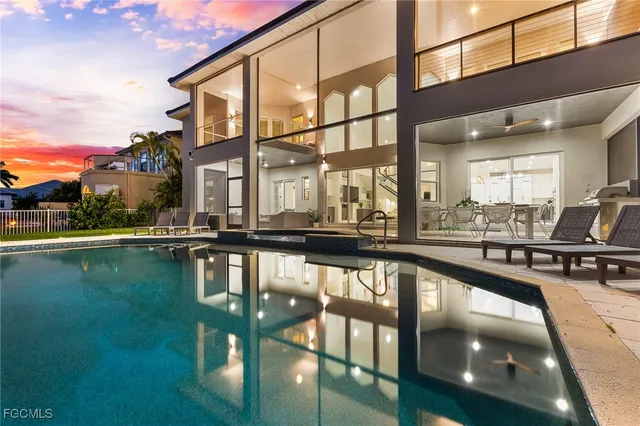 a view of a swimming pool with a lounge chair
