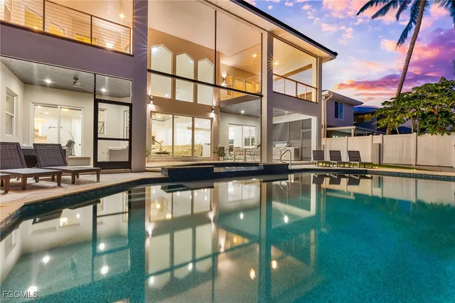 a view of swimming pool with outdoor seating