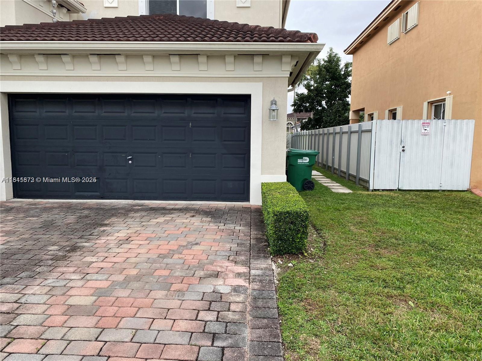 15603 Southwest 178th Street Miami, FL 33187 - Photo 11 of 11 a front view of a house with garden