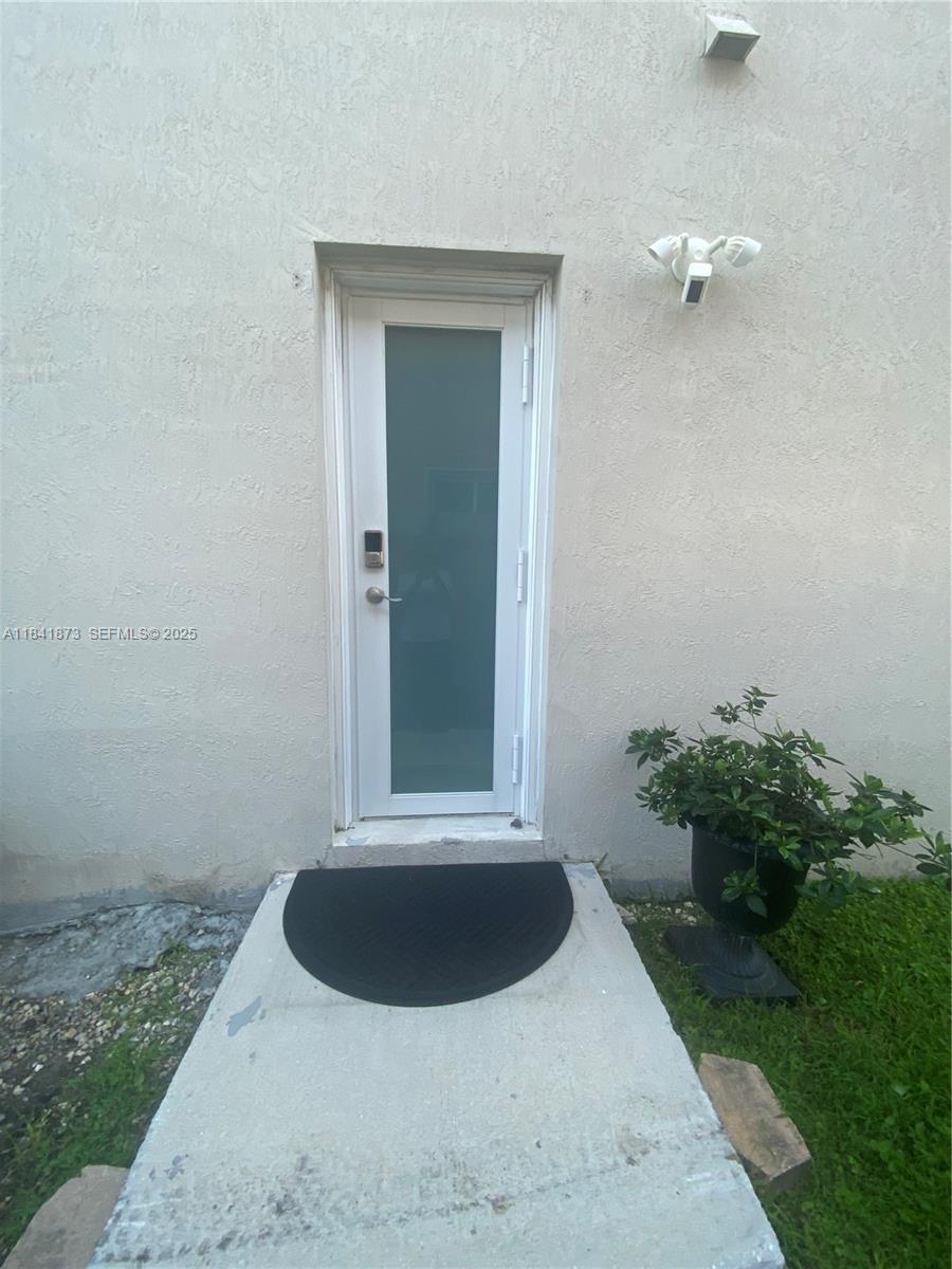 15603 Southwest 178th Street Miami, FL 33187 - Photo 11 of 11 a view of a house with a backyard