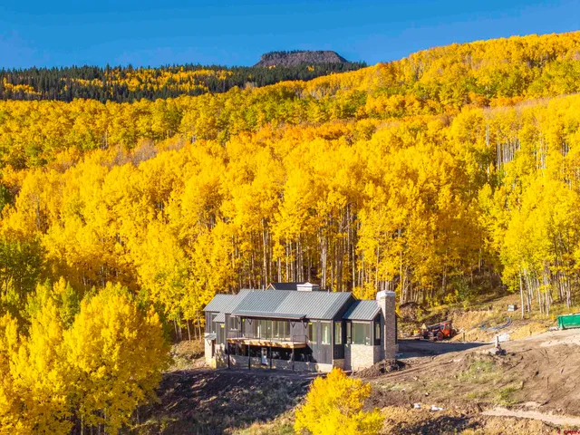 a view of a swimming pool with a table and chairs