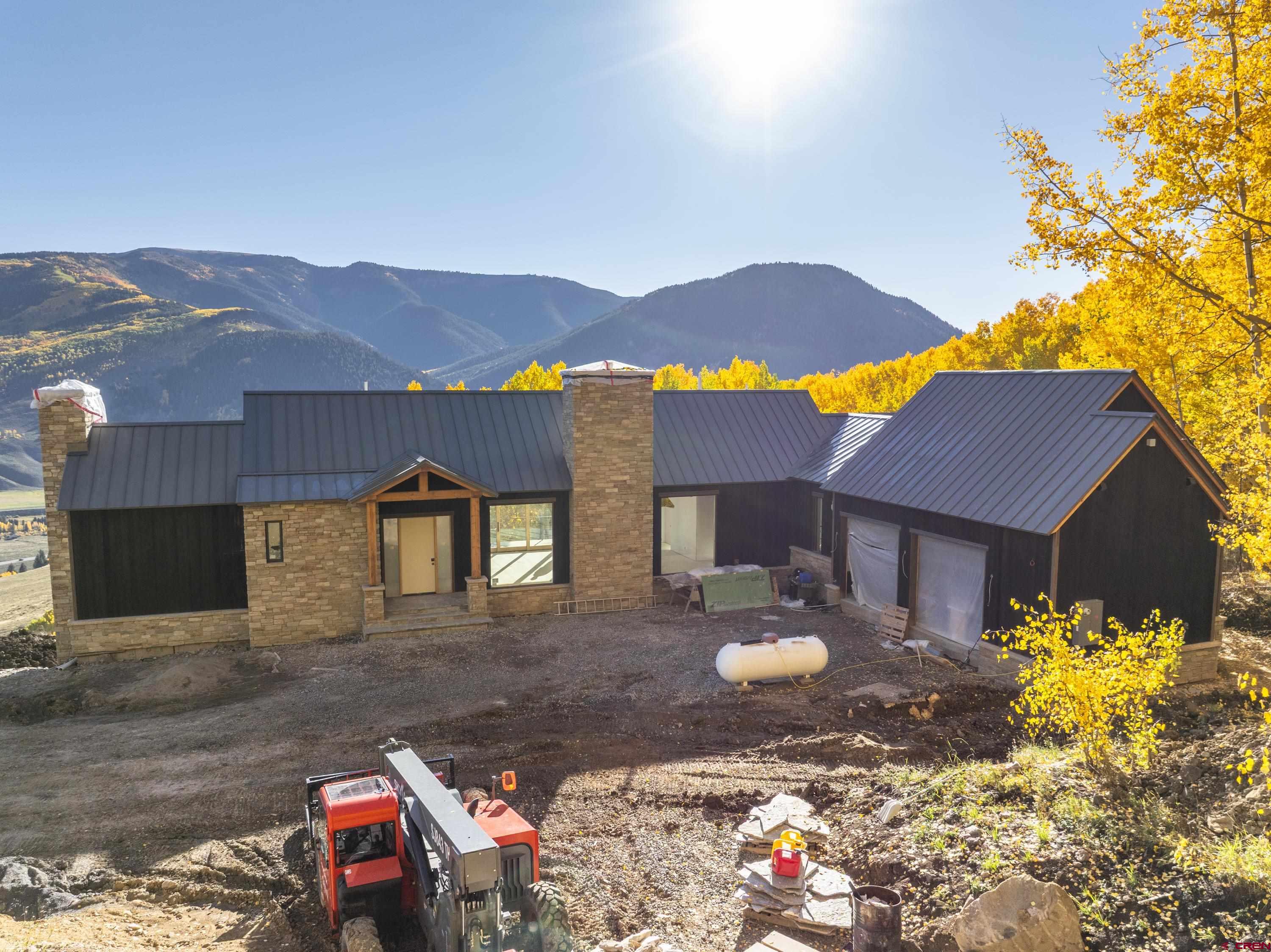 1620 Red Mountain Ranch Road Crested Butte, CO 81224 - Photo 11 of 45 a view of a house with a yard and sitting area