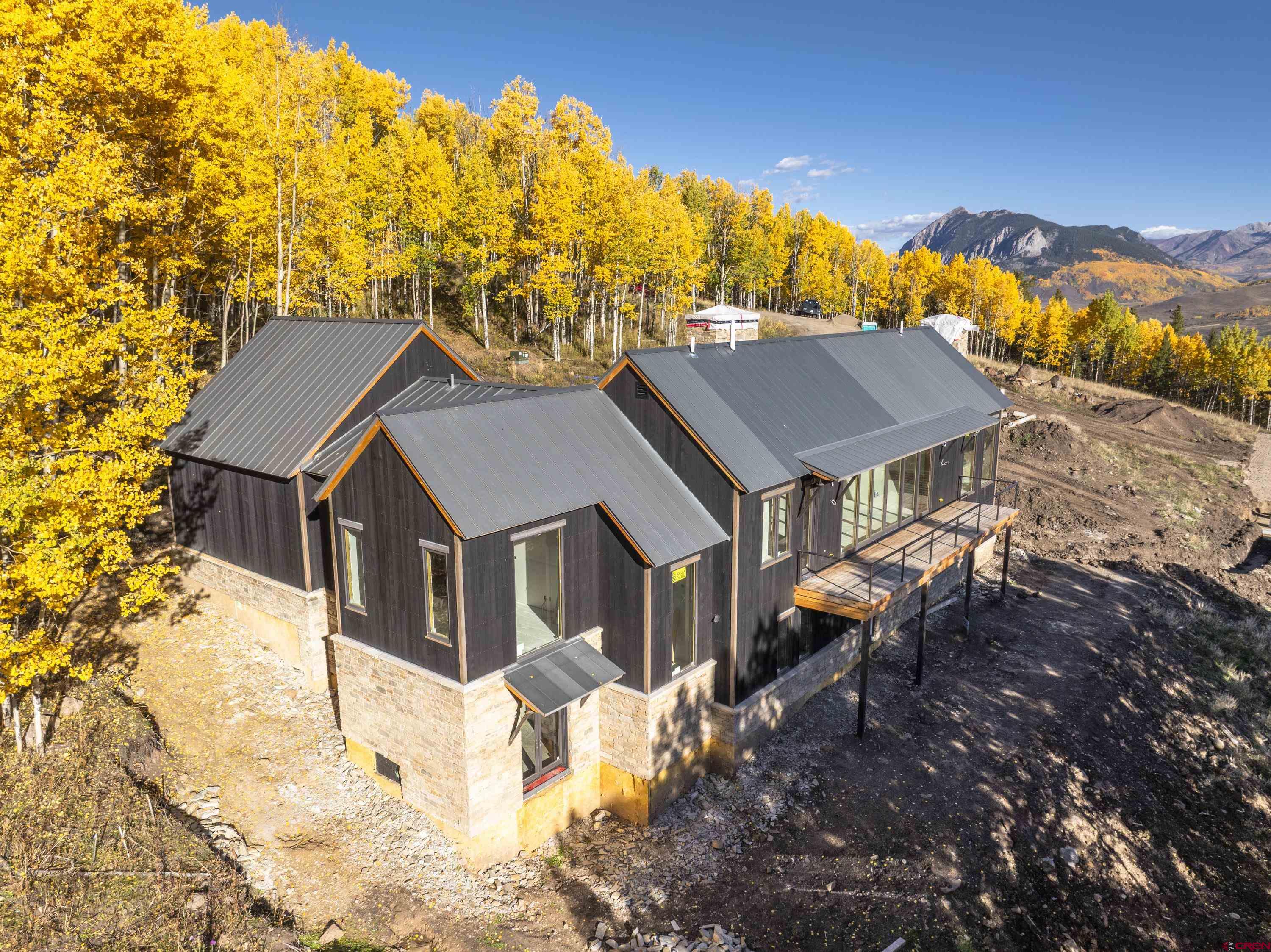 1620 Red Mountain Ranch Road Crested Butte, CO 81224 - Photo 12 of 45 a aerial view of a house with a yard