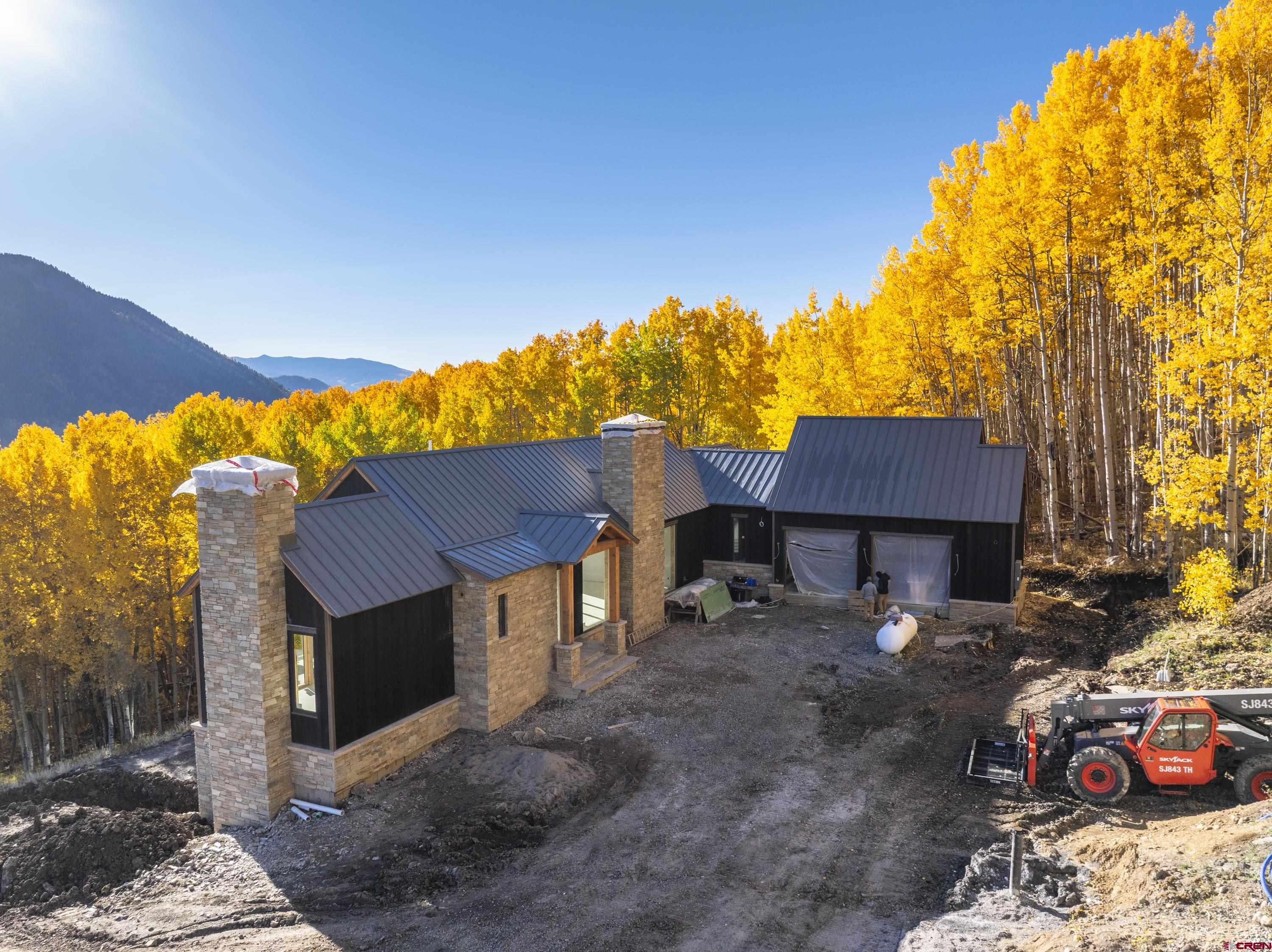 1620 Red Mountain Ranch Road Crested Butte, CO 81224 - Photo 14 of 45 a front view of a house with a yard