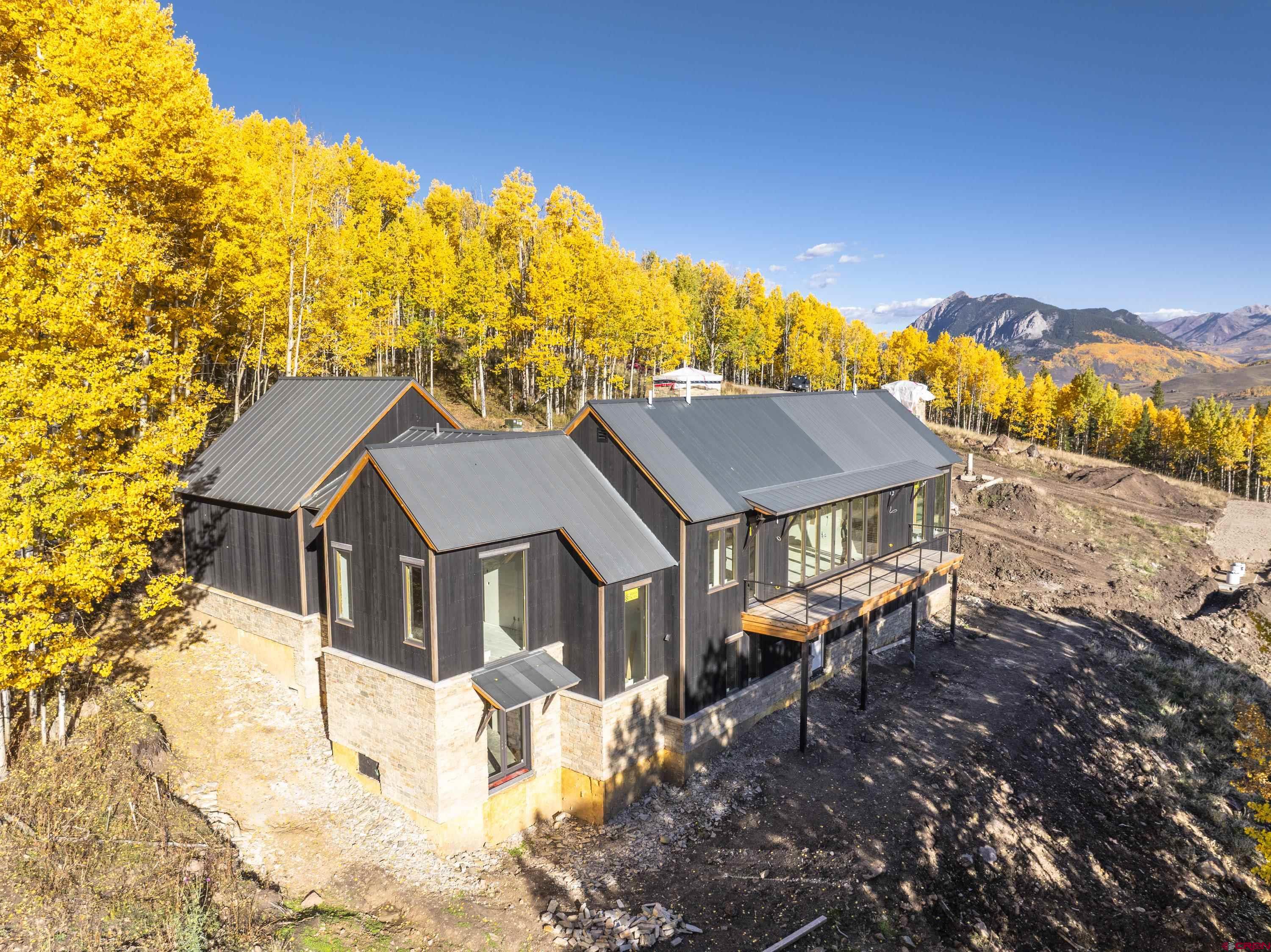 1620 Red Mountain Ranch Road Crested Butte, CO 81224 - Photo 2 of 45 a view of house with a yard