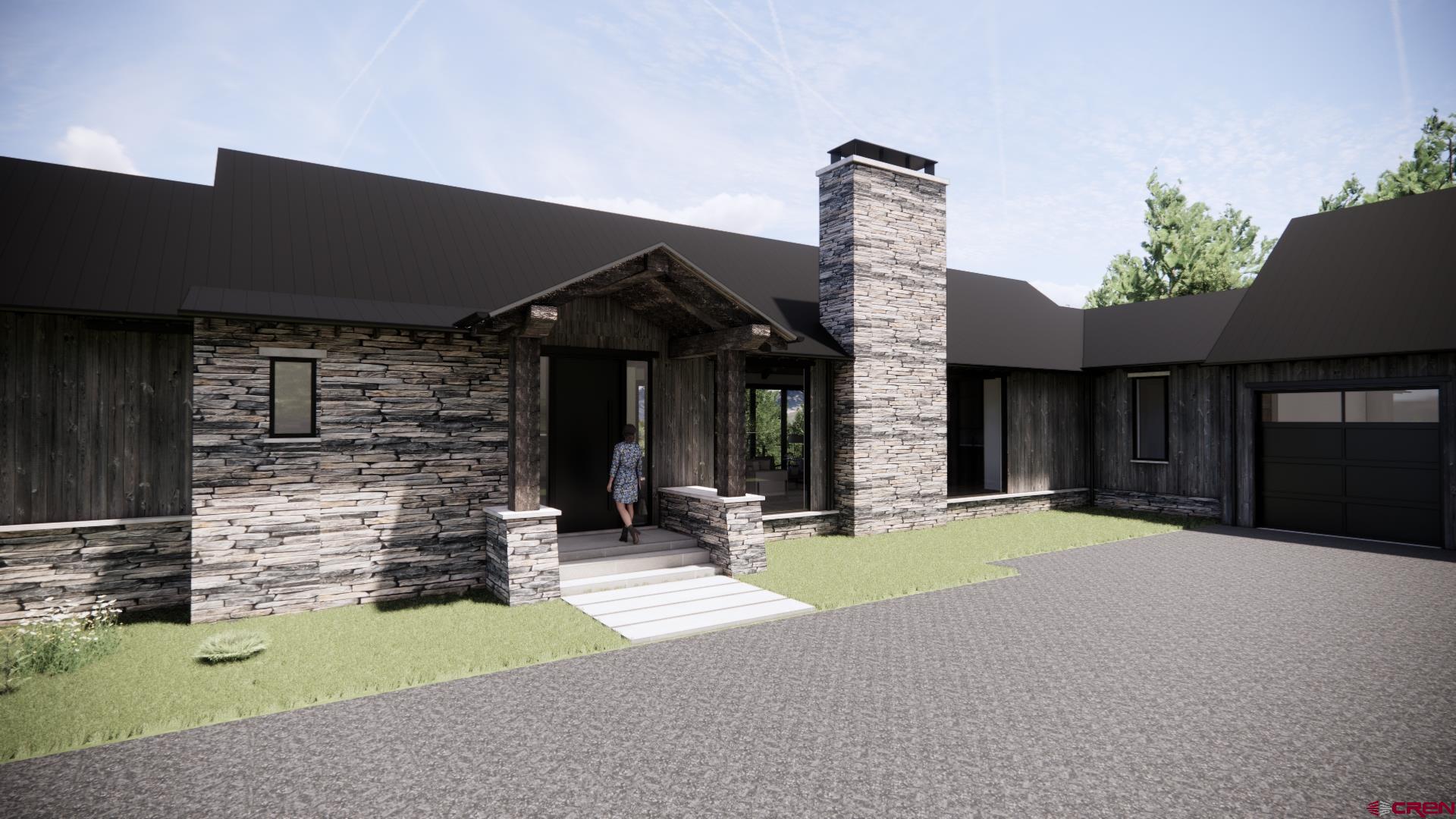 1620 Red Mountain Ranch Road Crested Butte, CO 81224 - Photo 22 of 45 a front view of a house with a yard and garage