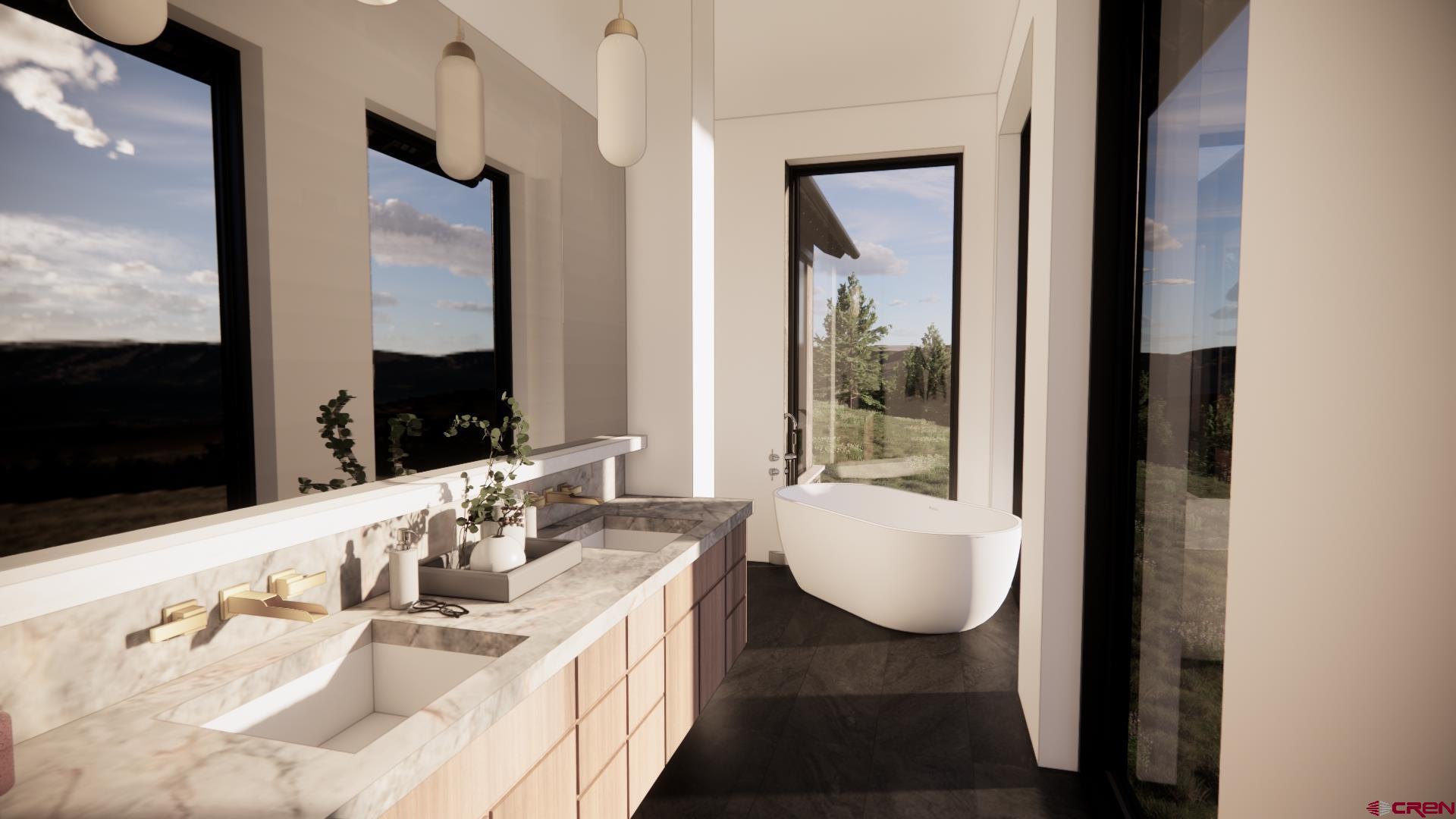 1620 Red Mountain Ranch Road Crested Butte, CO 81224 - Photo 29 of 45 a bathroom with a tub sink and mirror