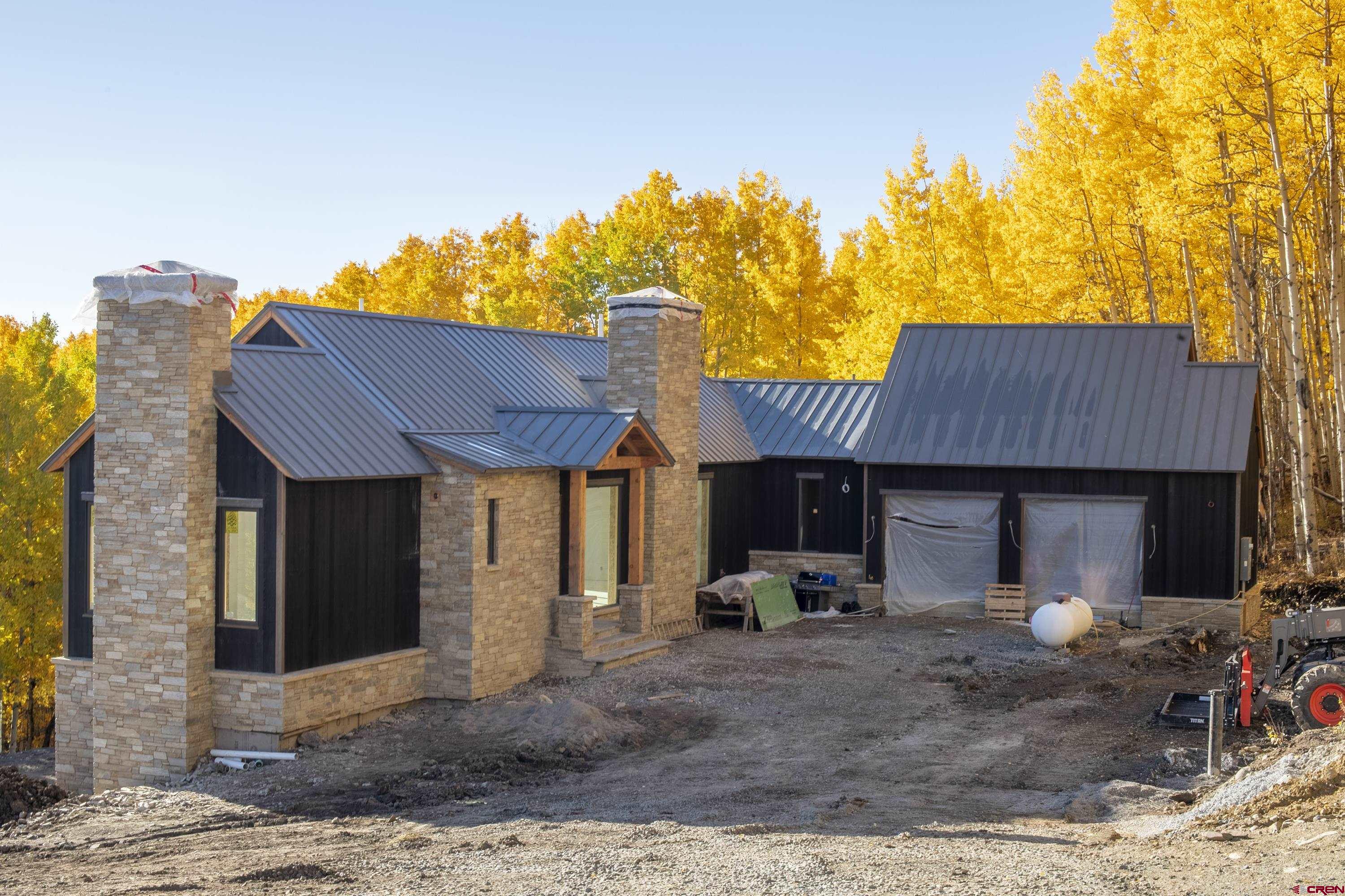 1620 Red Mountain Ranch Road Crested Butte, CO 81224 - Photo 3 of 45 a front view of a house with garden