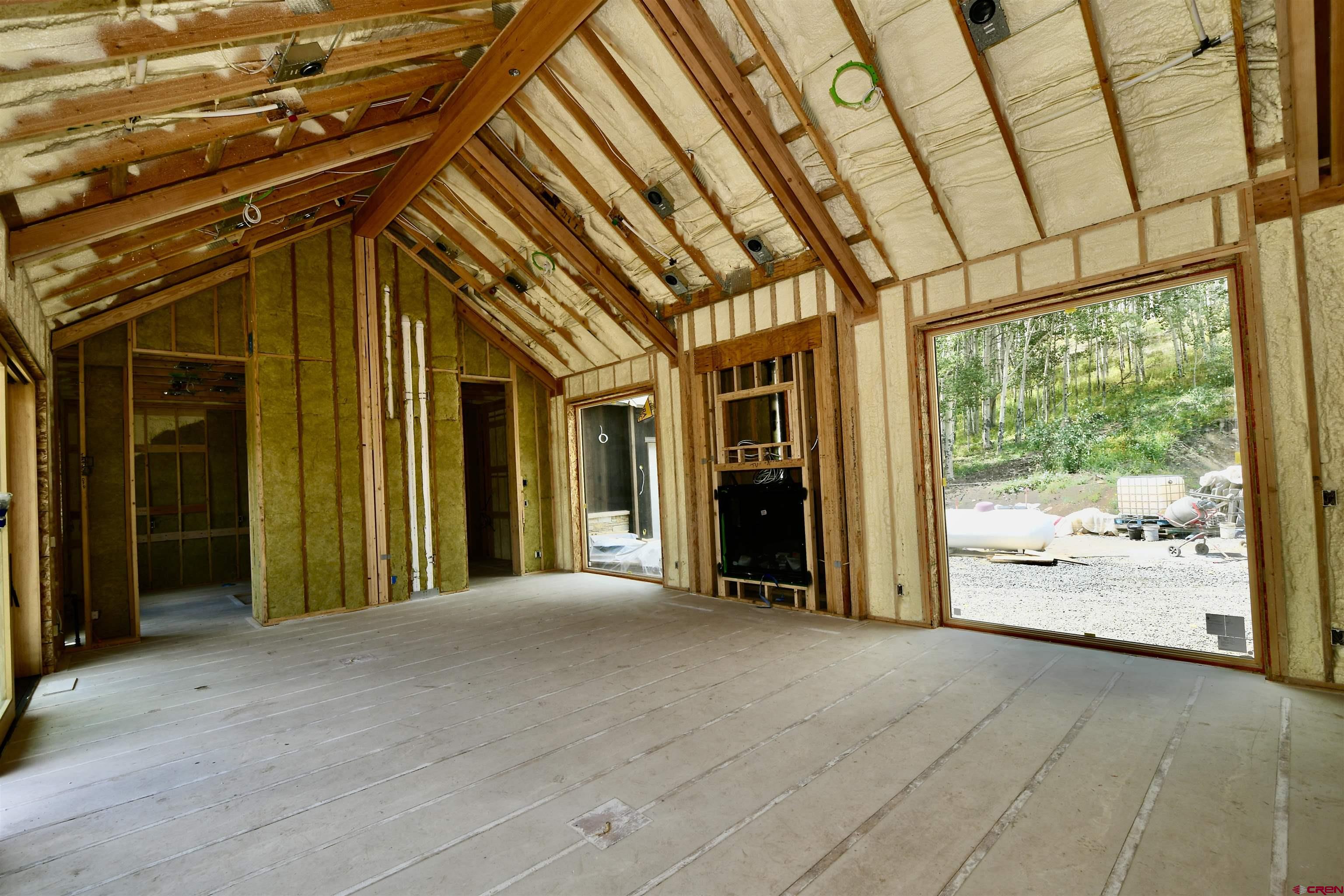 1620 Red Mountain Ranch Road Crested Butte, CO 81224 - Photo 37 of 45 a view of a hallway with wooden floor and fence