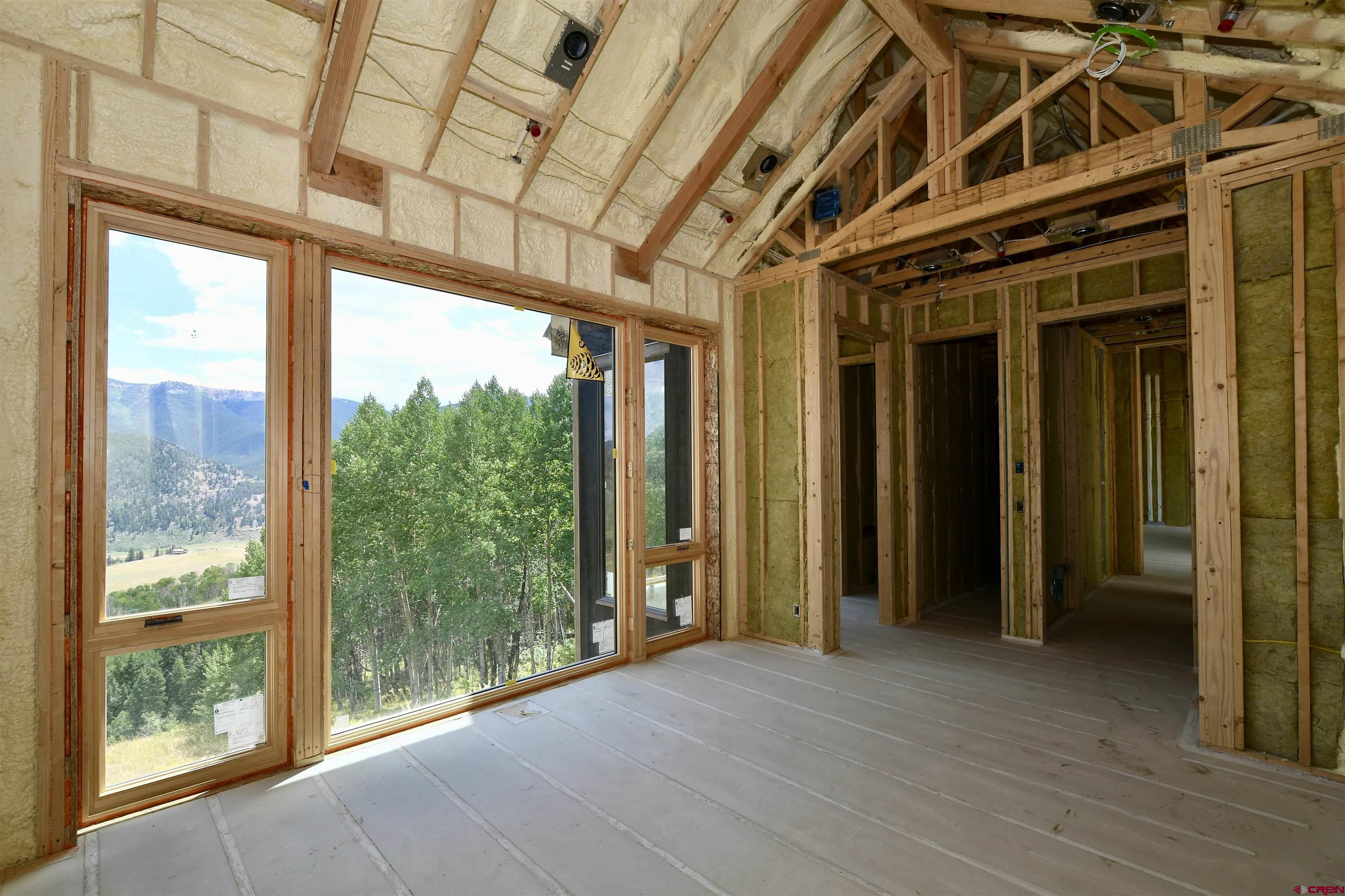 1620 Red Mountain Ranch Road Crested Butte, CO 81224 - Photo 40 of 45 a view of hallway with furniture and a window