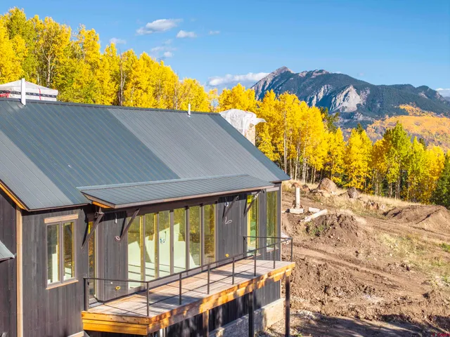 a view of a balcony with furniture