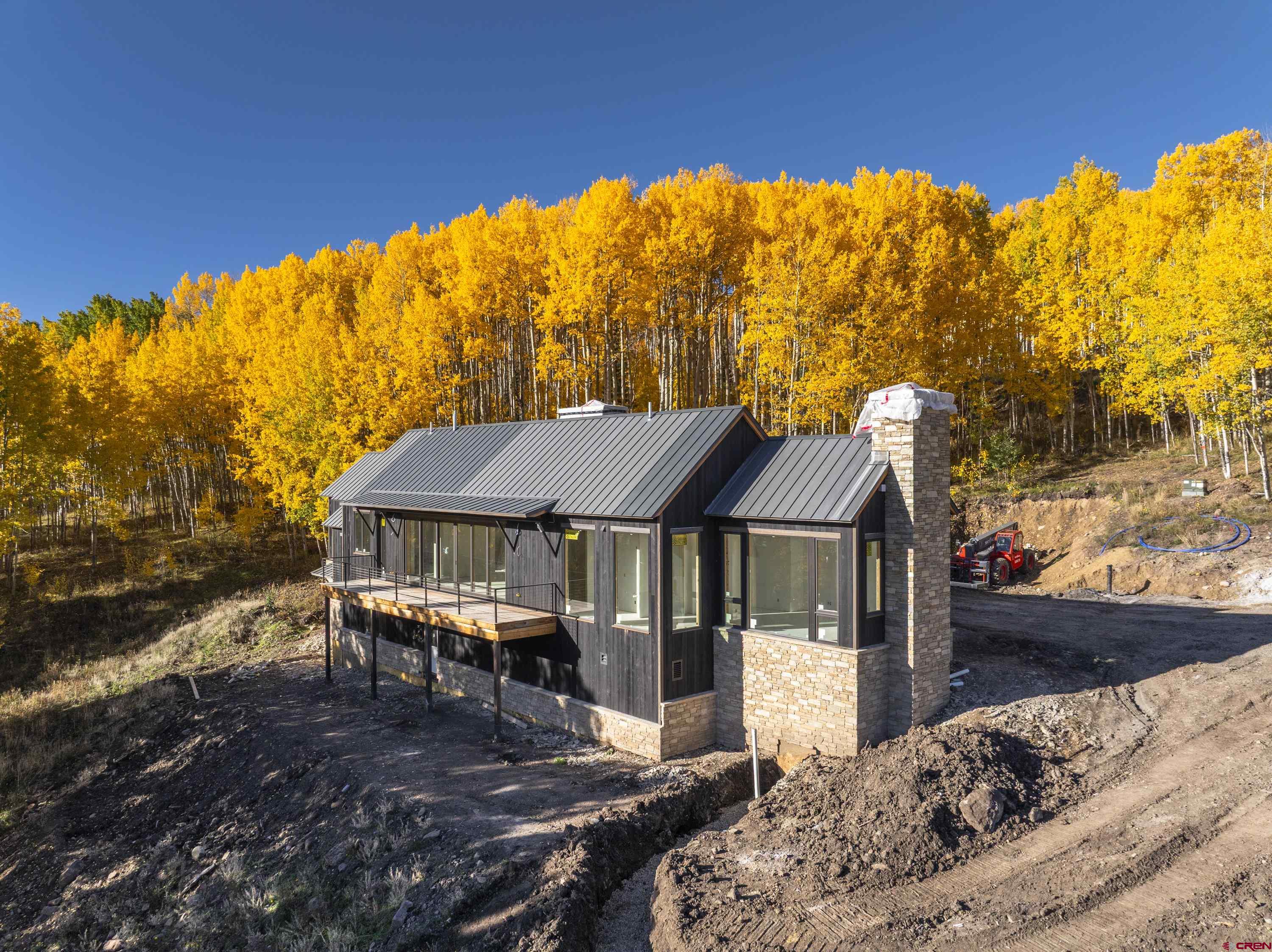1620 Red Mountain Ranch Road Crested Butte, CO 81224 - Photo 5 of 45 a backyard of a house with table and chairs