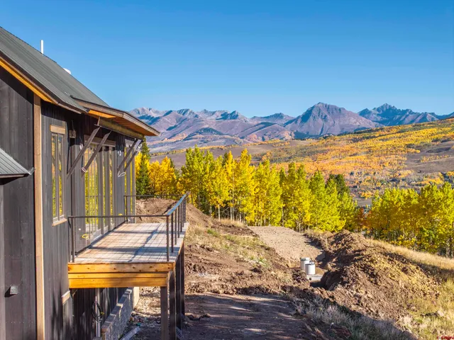 a view of a balcony with chair and table