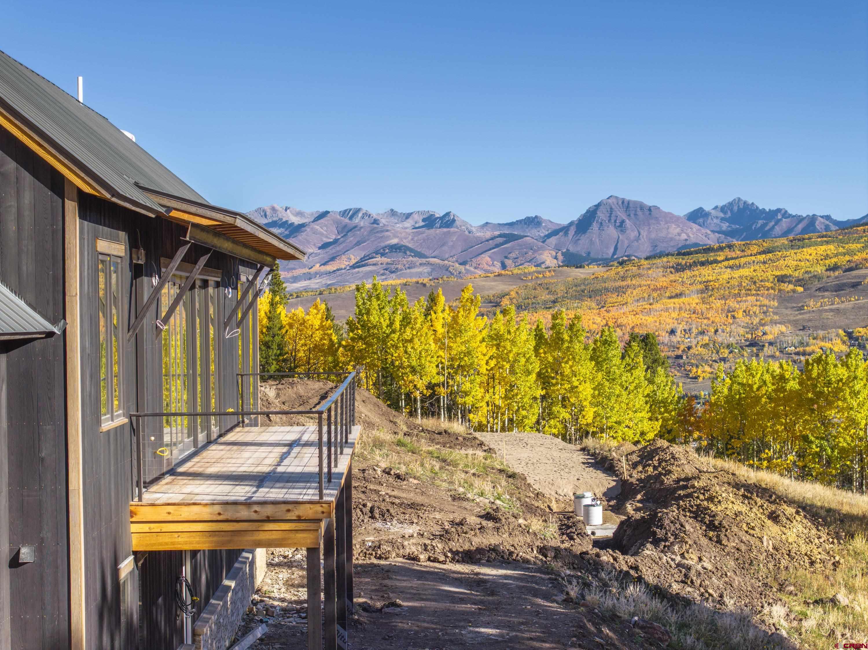 1620 Red Mountain Ranch Road Crested Butte, CO 81224 - Photo 8 of 45 a view of a balcony with chair and table