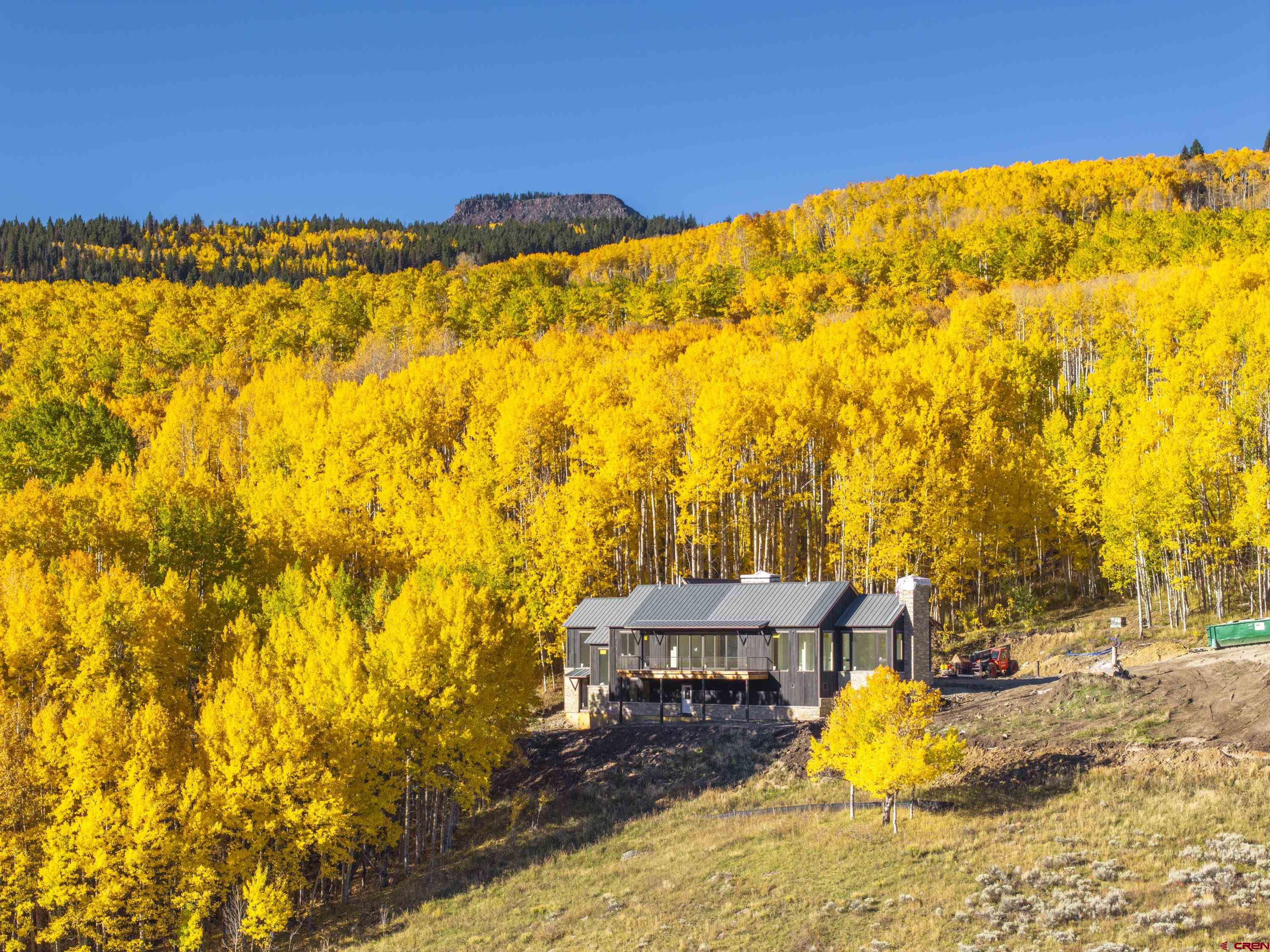 1620 Red Mountain Ranch Road Crested Butte, CO 81224 - Photo 9 of 45 a view of a swimming pool with an outdoor space and seating area